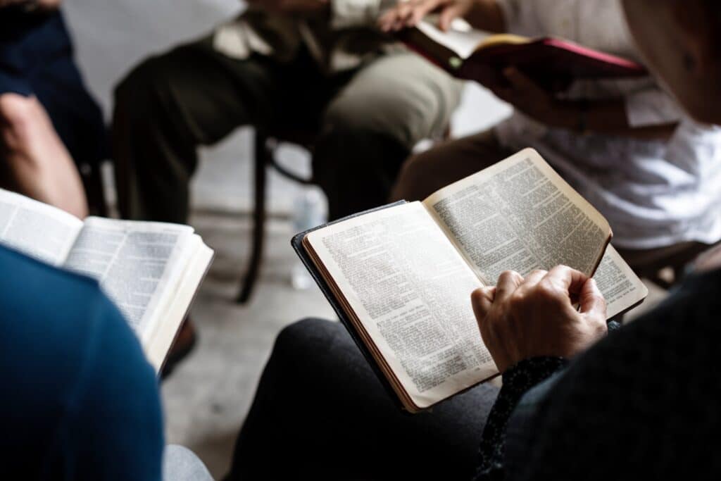A group of people reading the Bible together during Nashville addiction recovery classes. 