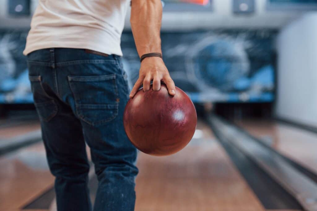 Man goes bowling during his addiction recovery program.
